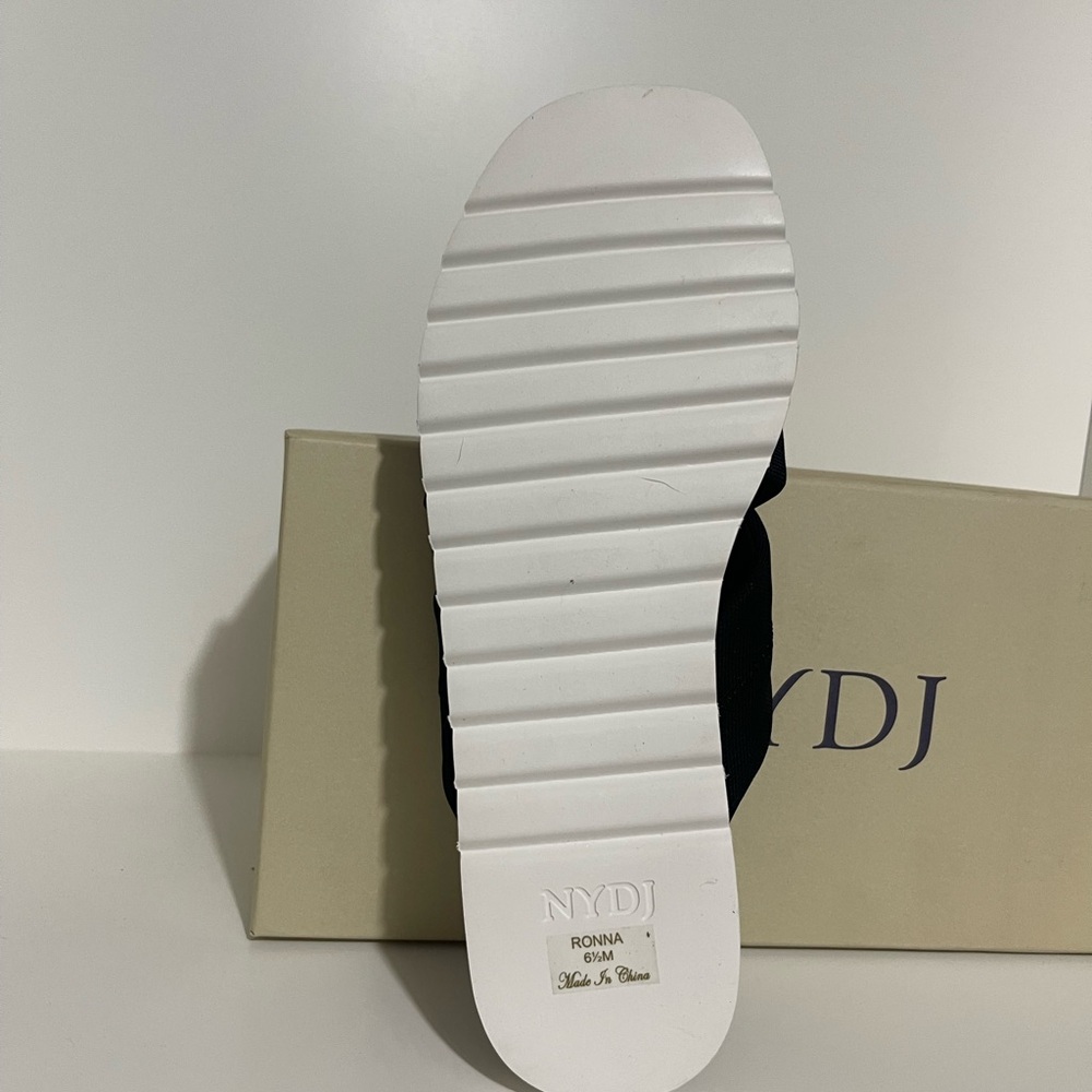 comfort as you walk on the streets wearing the NYDJ® Ronna footwear. - Picture 3 of 6